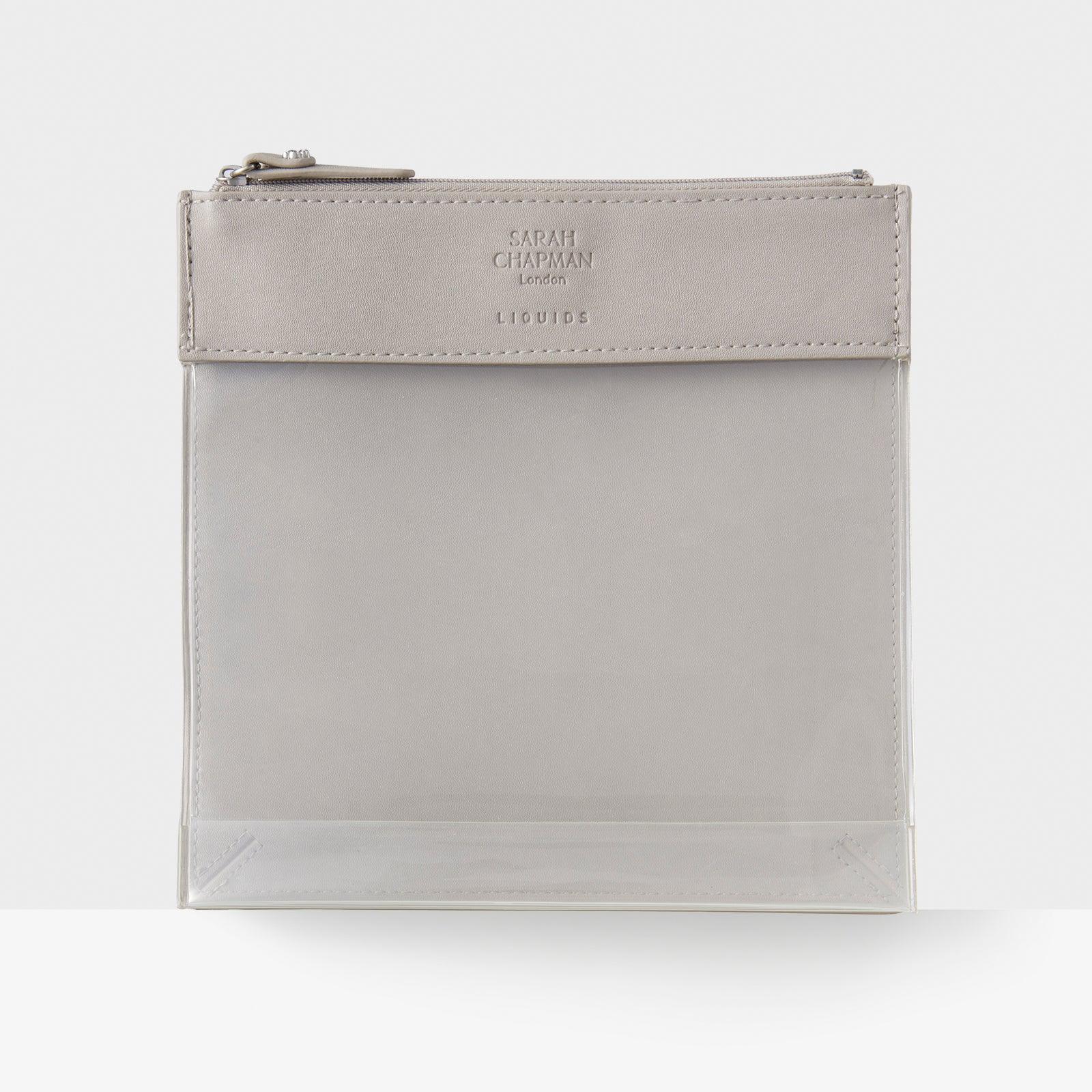 Sarah Chapman Skinesis Flight Mode Bag dual-sided cosmetics bag for travel. Dedicated liquids pouch.